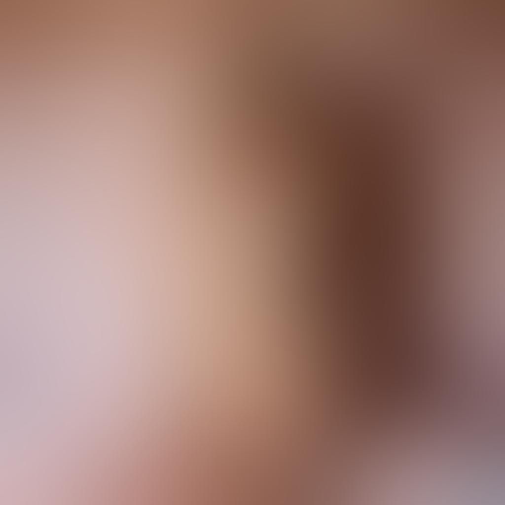 A captivating scene showcasing a nude blonde beauty in an elegant pose, surrounded by soft, flowing fabrics that enhance her glamour. The background features a subtle blend of dreamy colors like soft pinks and golds, emphasizing a sense of eroticism and allure. The lighting is warm and inviting, casting gentle shadows that accentuate the curves of her body. The overall composition conveys intimacy and sophistication while maintaining artistic quality. super-realistic. vibrant colors. soft focus.